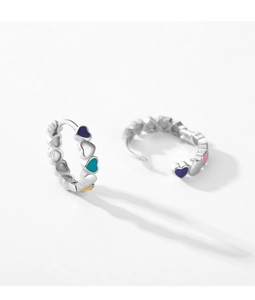 Detail of S925 sterling silver hoop earrings with colorful enamel heart charms