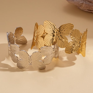 Textured butterfly engraved open cuff bracelet set in gold and silver finish