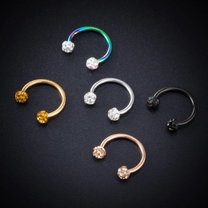 Five stainless steel horseshoe rings with crystal balls in gold, silver, and black finish