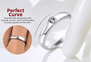 Detailed macro view of silver plated couple ring with single diamond and smooth curved band