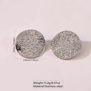 Detailed view of 2.96cm silver stainless steel round earrings with hammered texture