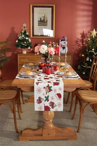 Detailed Christmas table runner with festive patterns on a rustic wooden dining table