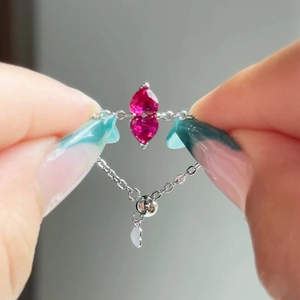 Adjustable silver chain ring featuring dual pink heart crystals and a sliding bead clasp