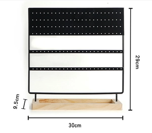 Detail view of 144-hole earring stand with exact dimensions 30cm x 29cm on wood base