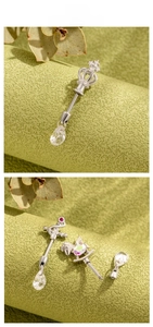 Detailed display of silver surgical steel piercing jewelry with crown and horse charms