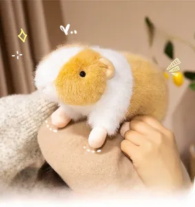 Detailed shot of a realistic yellow and white guinea pig plush toy on a brown beret