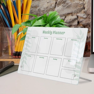 Macro shot of a transparent acrylic weekly planner board with metal desktop stands