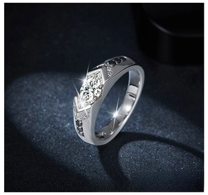 Detailed macro view of marquise-cut moissanite ring with black accent stones in silver