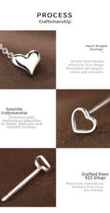 Detailed macro view of S925 sterling silver heart earrings with polished finish