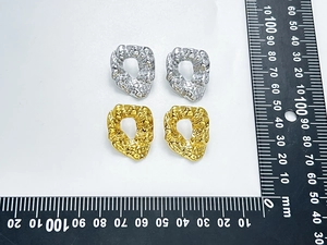 Size reference of gold and silver hoop earrings with irregular hammered texture on metal