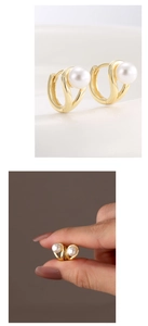 Macro detail of elegant 14K gold plated S-shaped hoop earrings with white shell pearl