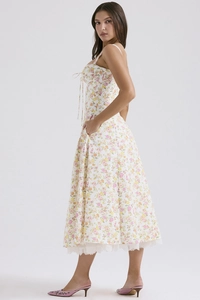 Detail of floral summer dress with lace hem, spaghetti straps and side pockets