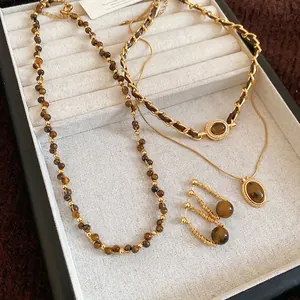 Set di gioielli di lusso in occhio di tigre placcato oro 18 carati con collane e orecchini