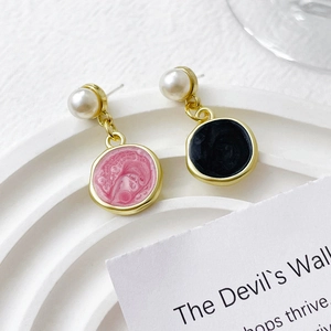 Gold asymmetric enamel drop earrings with pink and black round charms and pearl accents