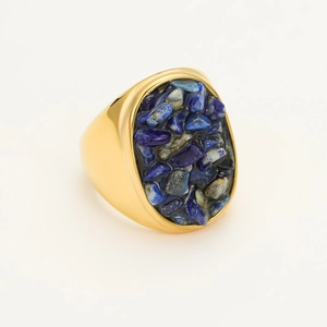 Macro shot of gold stainless steel ring with oval lapis lazuli stone inlay details
