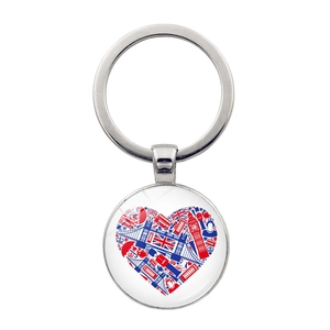 Close-up of silver keychain with heart-shaped London landmarks under glass dome