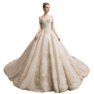 Luxury off-the-shoulder bridal gown with gold vine embroidery and long wedding train