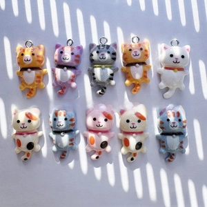 Detailed collection of ten colorful resin cartoon cat charms for DIY jewelry and crafts