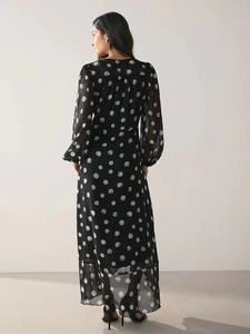 Elegantes schwarzes Langarm-Midikleid mit Polka Dots und tailliertem Schnitt, Rückansicht