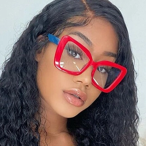 Close-up of woman wearing oversized red and blue square frames with anti-blue light lenses