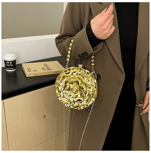 Detailed view of a gold 3D rose-shaped chain bag with acrylic floral texture