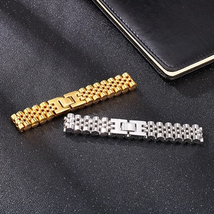 Close-up of gold and silver stainless steel watch strap bracelets on black background