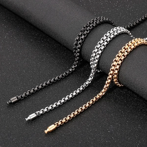 Detailed view of punk style square pearl chains in black, silver, and rose gold finishes