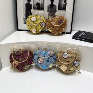 Sparkly heart-shaped sequin evening bags with metal handles and chain straps in five colors