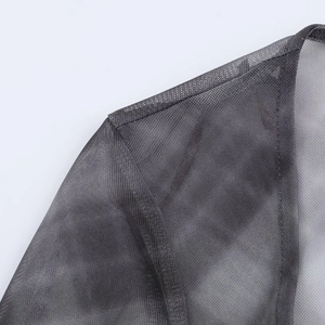 Close-up of shoulder seams and cuff edges on dark gray sheer mesh fabric clothing