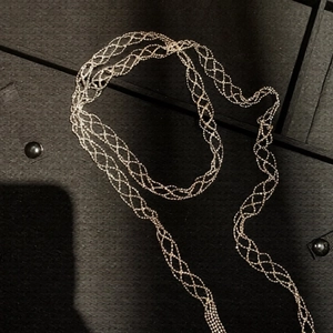 Minimalist mesh woven necklace with long layered chain and elegant cutout structure