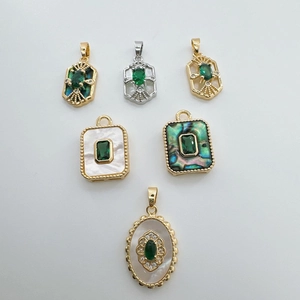 18K gold plated charms set with green emerald stones and mother of pearl in various shapes
