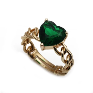 Detail of adjustable gold-plated chain ring featuring a heart-shaped green zircon gemstone