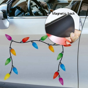 Detail of magnetic back on colorful Christmas bulb stickers for car and fridge decoration