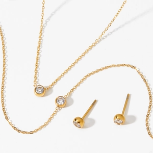Elegant gold-plated stainless steel jewelry set with round cubic zirconia pendants
