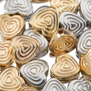Golden and silver plastic CCB heart beads with a layered 3D texture for DIY jewelry making