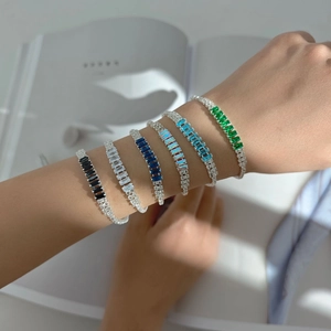 Chic silver bracelet with colorful cubic zirconia stones worn on a model's wrist