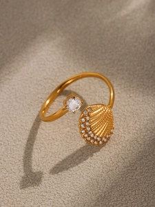 Macro shot of 18k gold plated ring with a scallop seashell and large zircon accent