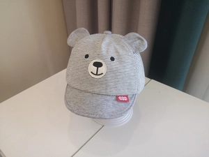 Detail of baby striped baseball cap featuring cute bear embroidery and 3D ears