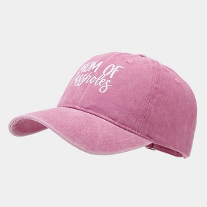 Detail of vintage pink washed cotton baseball cap with Mom of Assholes embroidery