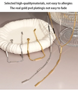 Detail of PVD gold and silver plated stainless steel jewelry sets showing texture
