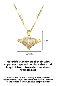 Detail of gold broken heart pendant with micro-pave crystals and size measurements