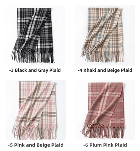 Collection of four classic British plaid scarves with tassels in multiple colorways