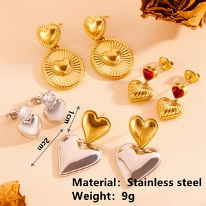 Golden and silver stainless steel heart earrings set with cubic zirconia detailing