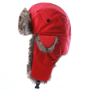 Detail view of red winter trapper hat featuring warm gray faux fur lining and buckle strap