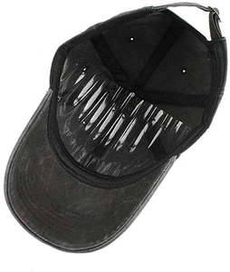 Detail view of washed cotton baseball cap interior with plastic support and adjustable strap