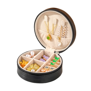 Portable round black faux leather jewelry box with zipper for rings and necklaces