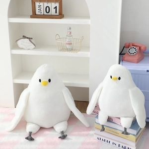 Soft white pigeon plush toys set in a cozy home setting for nursery decor