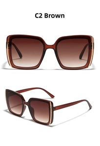 Detail view of square tea brown sunglasses with gold metal accents and gradient lenses