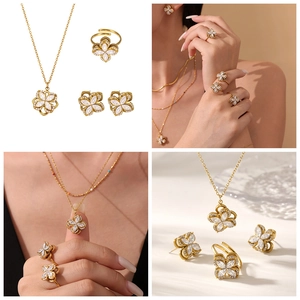 Detailed views of 18k gold plated stainless steel spinning flower jewelry set for women
