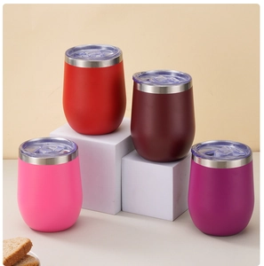 Vasos térmicos de acero inoxidable en forma de huevo en rojo, rosa y púrpura con tapas claras